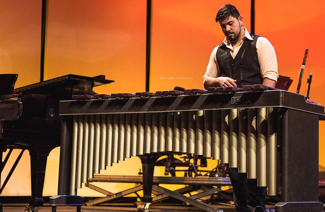 Renan at the marimba at golden hour